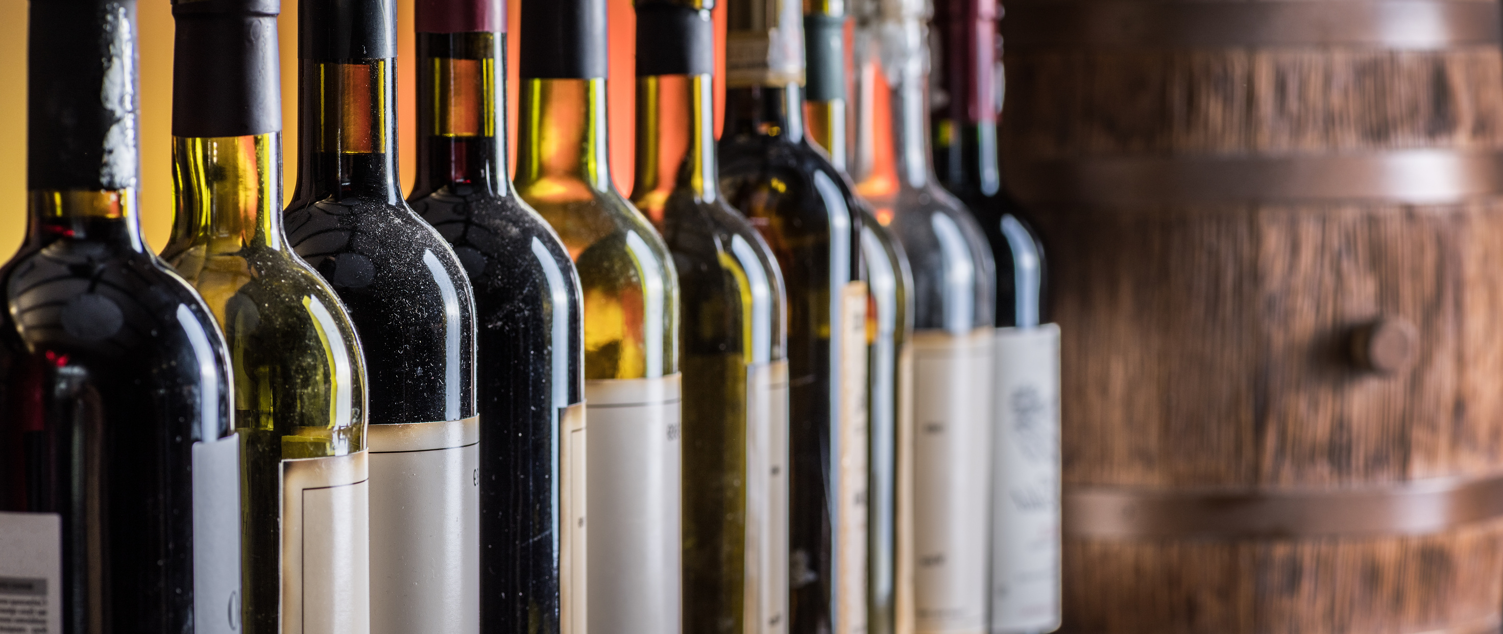 Wine bottles in row.